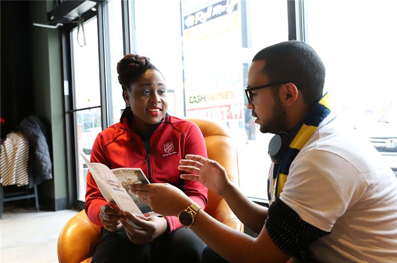 A client is being helped by the MU staff